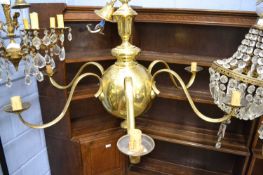 A large brass six branch ceiling light fitting in the Dutch style, approx 90cm wide