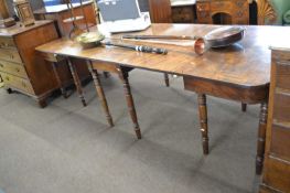 A Victorian mahogany sectional dining table formed of two D shaped ends and a drop leaf centre
