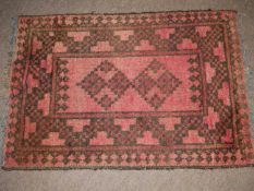 Small Middle Eastern wool prayer mat, decorated with geometric design on a red background, 72cm