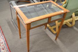 An Edwardian bijouterie display table of rectangular form with hinged lid and fabric lined interior,