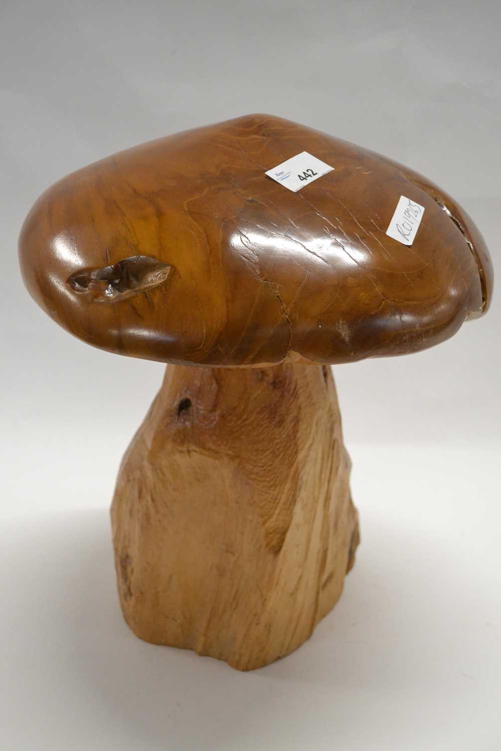 A carved wooden model of a toadstool with polished top, 35cm high
