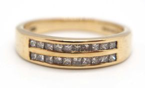 A 9ct diamond ring, set with two rows of small round diamonds, with tapered shoulders and plain band