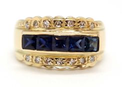 A sapphire and diamond ring, the 10.5mm band set with a central row of claibre cut sapphires with