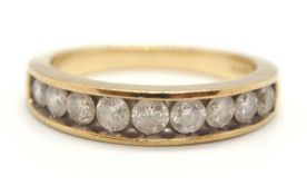 A 9ct diamond ring, the upper half set with nine slightly graduated round brilliant cut diamonds,