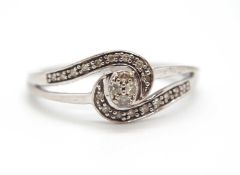 A 9ct diamond ring, set to centre with four small round diamonds, with an asymetric sweep of