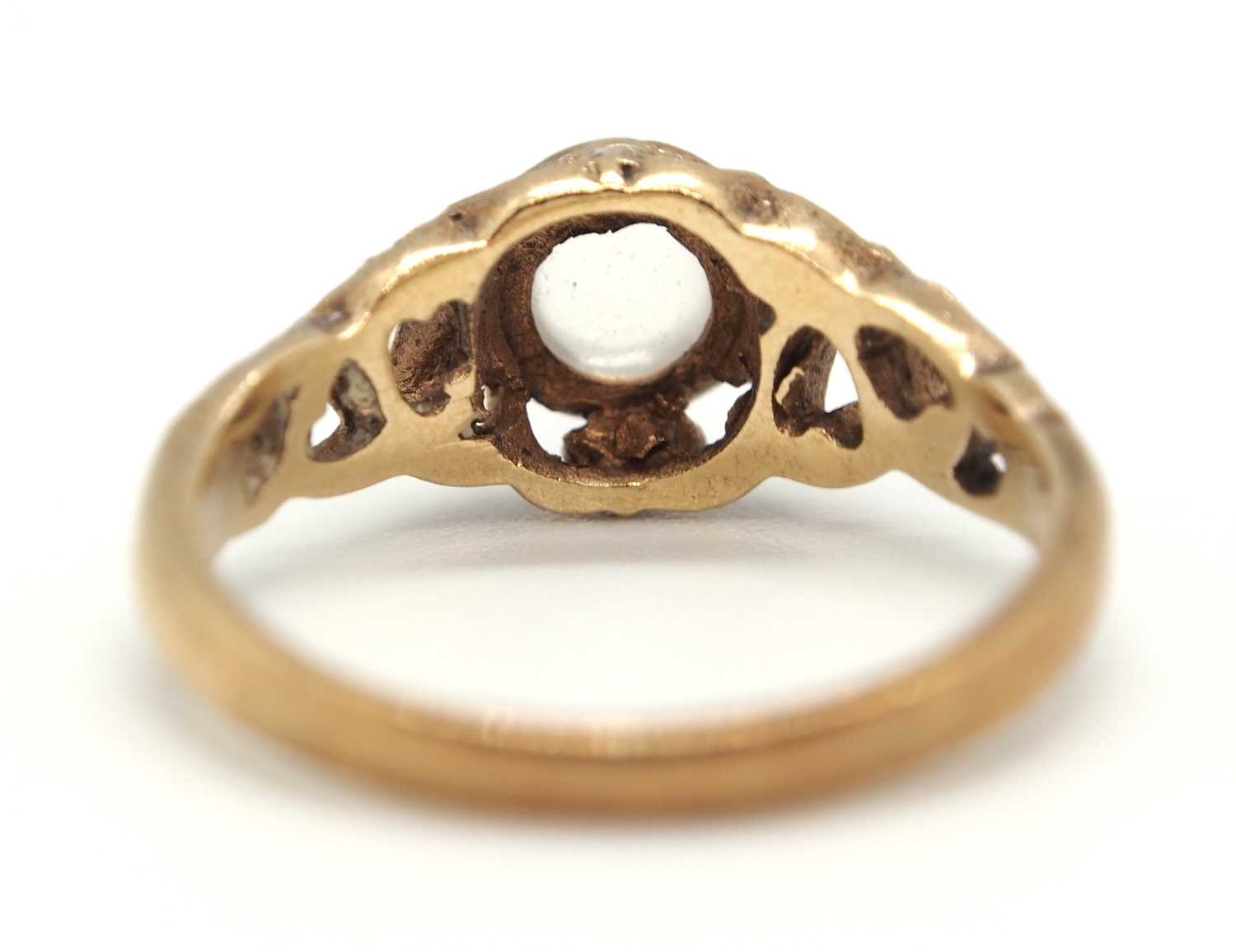 A 9ct moonstone ring, the round moonstone cabochon in a rubover mount with scrolled surround - Image 2 of 5