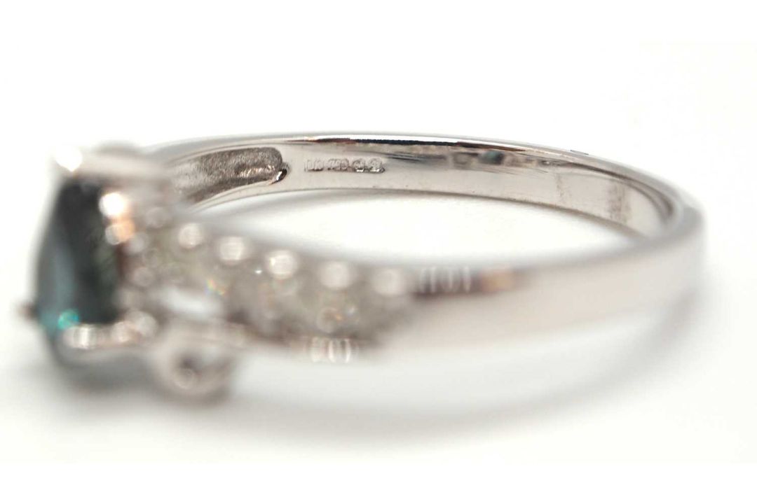 An 18ct white gold diamond and blue-green stone ring, the central blue-green pear shape stone set - Image 4 of 4