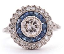 An early 20th century diamond and sapphire target ring, the central round brilliant cut diamond,