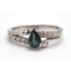 An 18ct white gold diamond and blue-green stone ring, the central blue-green pear shape stone set - Image 1 of 4