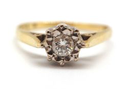 An 18ct diamond ring, the illusion set round brilliant cut diamond set in white gold, with a plain