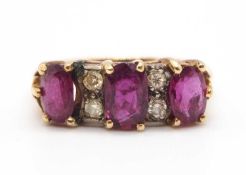 A ruby and diamond ring, the three oval rubies, interspaced with small round diamond highlights,