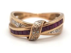A 9ct diamond and synthetic ruby crossover ring, with two crossover bands, one sat with small