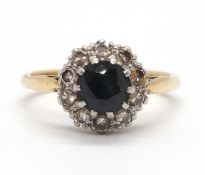 A sapphire and diamond ring, the round sapphire surrounded by single cut diamonds, all claw