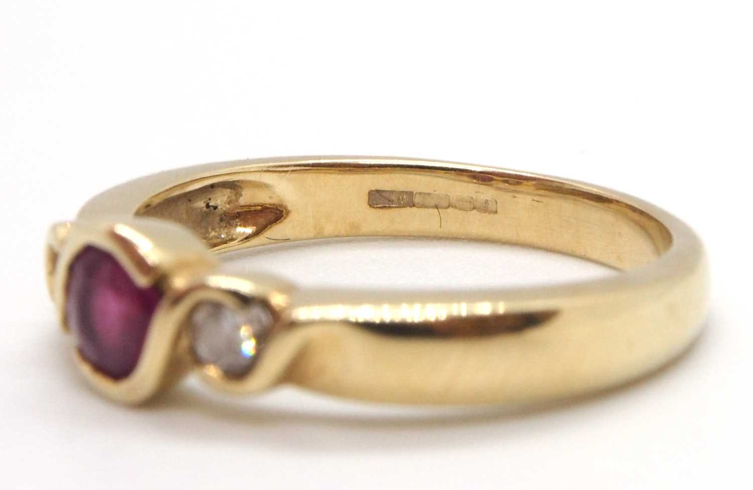 A 9ct ruby and diamond ring, the round collet mounted ruby with a round brilliant cut diamond to - Image 8 of 8