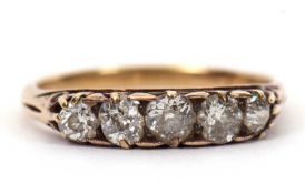 A five stone diamond ring, the five graudated old mine cut diamonds, total estimated approx. 1.