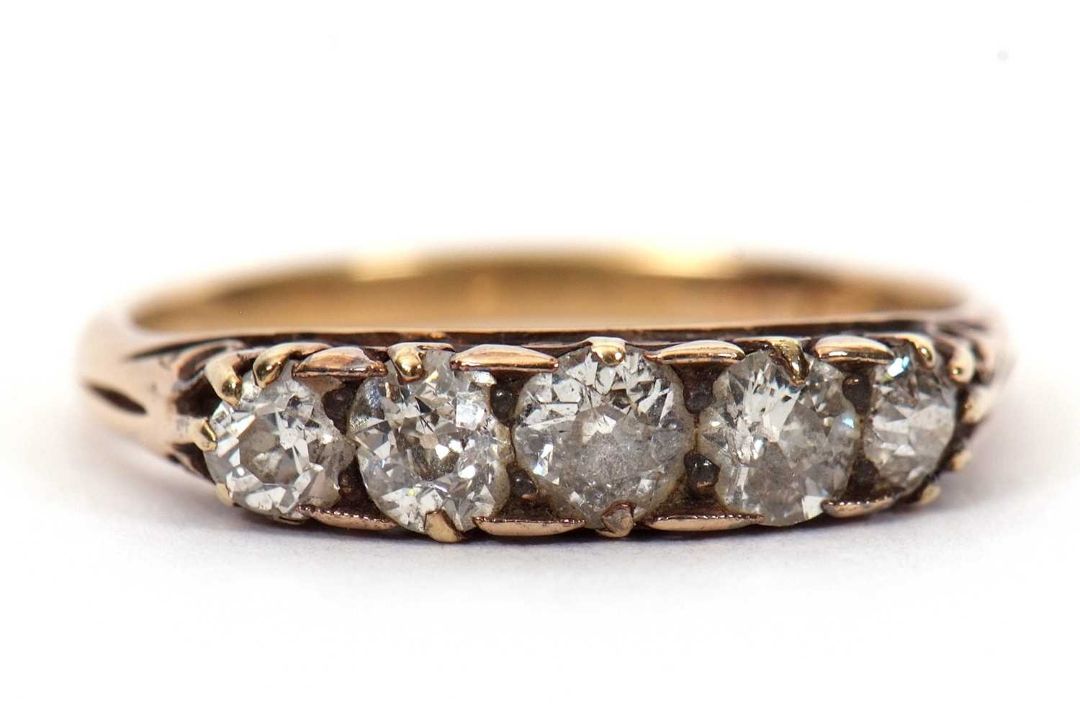 A five stone diamond ring, the five graudated old mine cut diamonds, total estimated approx. 1. - Image 1 of 6