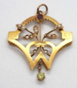 An Edwardian pendant, set with a peridot, amethyst and seed pearls, all set in unmarked yellow metal