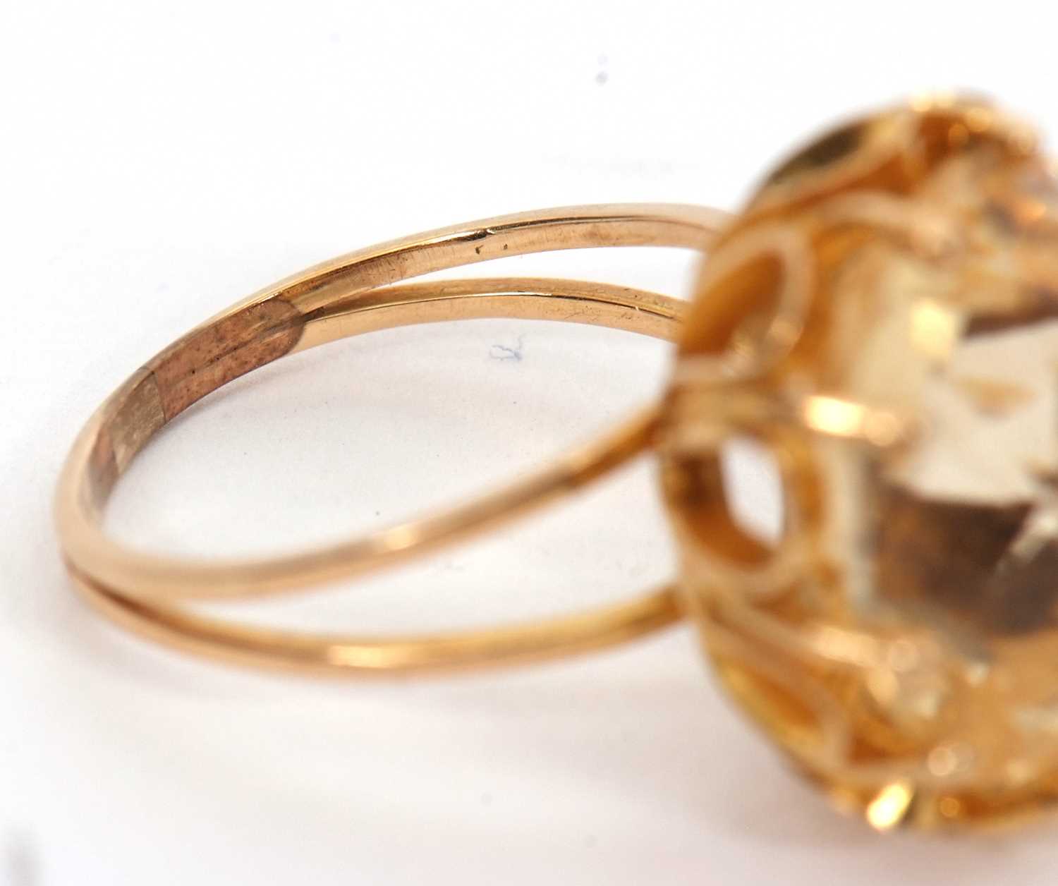 A citrine ring, the oval mixed cut citrine, approx. 16mm long, claw mounted with looped gallery, - Image 6 of 7
