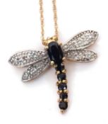 A sapphire and diamond dragonfly necklace, the dragonfly with dark blue sapphire body and white