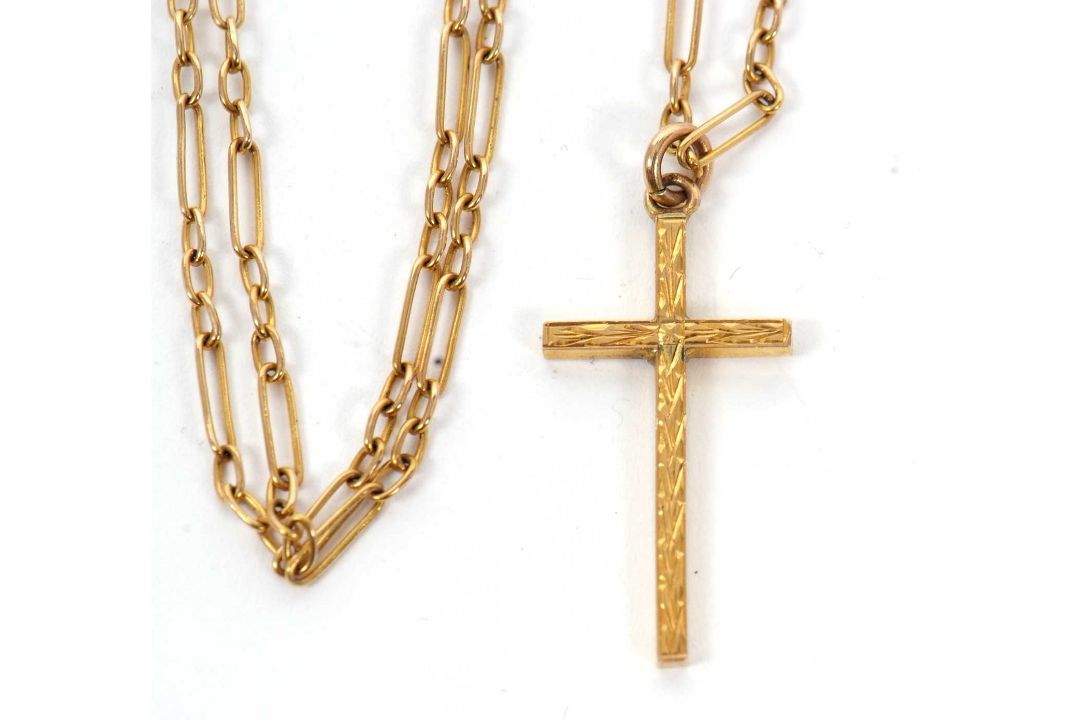 A fancy link cross and chain, the cross pendant with engraved decoration to one side and stamped 9ct - Image 1 of 3