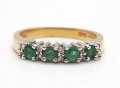 An 18ct emerald and diamond ring, set with four round emeralds interspaced with small round