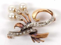 An early 20th century diamond and pearl brooch, the three fronds set with a single round 'pearl'