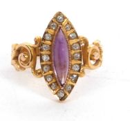An amethyst and diamond ring, the marquise amethyst cabochon surrounded with small round diamonds,