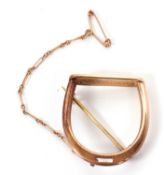 A stirrup brooch, the unmarked yellow metal stirrup (tests as approx. 9ct gold), 25mm wide, 6.7g
