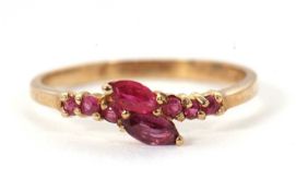 A 9ct ruby ring, set with two overlapping marquise shaped rubies with small round rubies to either