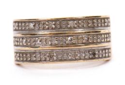 A 9ct diamond ring, the upper half set with three rows of small round diamonds, with tapered
