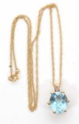 A 9ct topaz necklace, the oval blue topaz in a six claw mount with fixed bale stamped 375 with