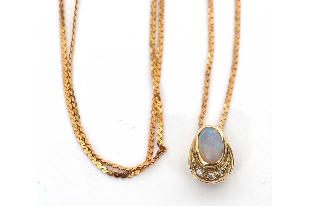 A 9ct opal and diamond pendant necklace, the oval opal cabochon in a pear shape mount with diamond - Image 4 of 4