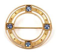 A late 19th/early 20th century sapphire brooch, the ring set with four pale blue sapphires, all