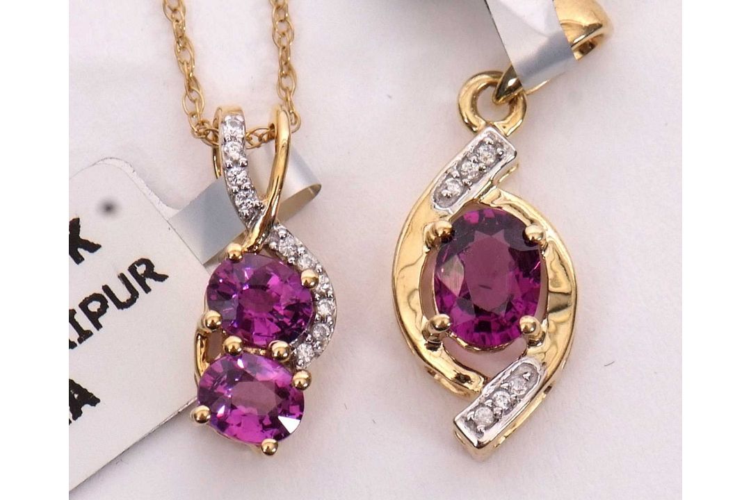 Two 10k rubelite necklaces: to include a two stone rubelite and white stone pendant stmaped 10K, - Image 1 of 2