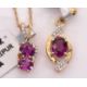 Two 10k rubelite necklaces: to include a two stone rubelite and white stone pendant stmaped 10K, - Image 1 of 2