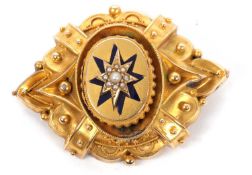 A Victorian enamel and seed pearl memorial brooch, the central oval panel set with a blue enamel