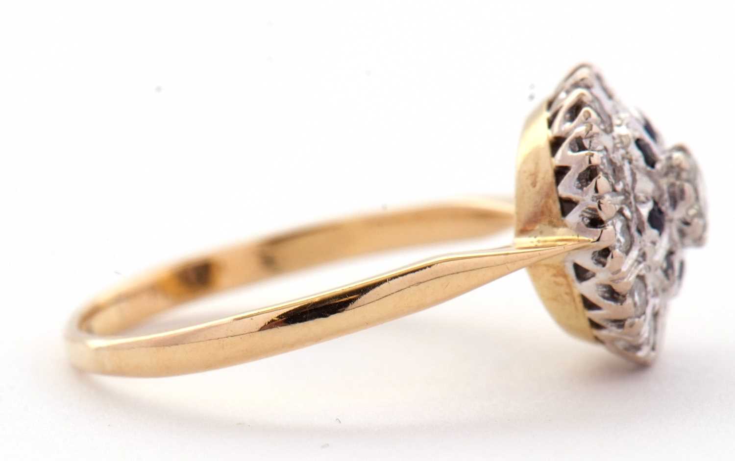 A sapphire and diamond cluster ring, the central round brilliant cut diamond surrounded by a ring of - Image 5 of 7