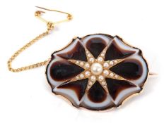 A Victorian seed pearl and agate brooch, the shaped banded agate inset with a seed pearl star set in
