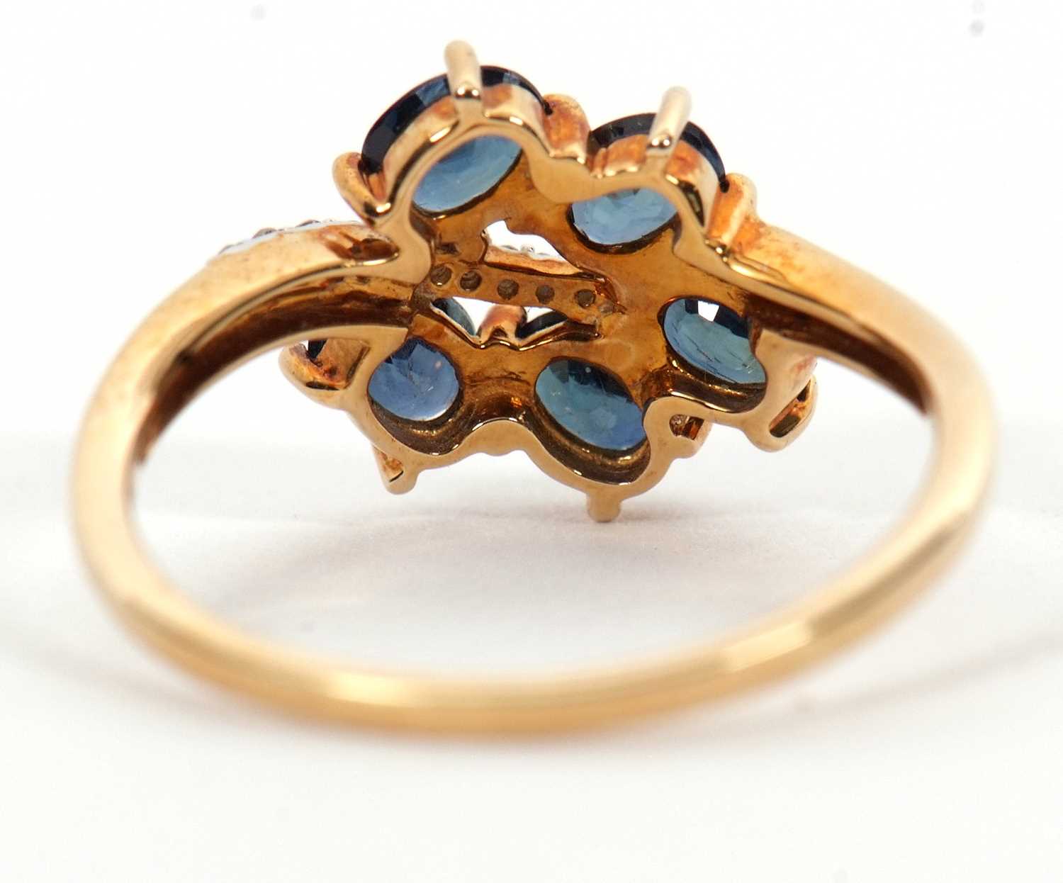 A 9ct blue stone and diamond ring, the leaf shape ring set with five oval blue stones (probably - Image 4 of 6
