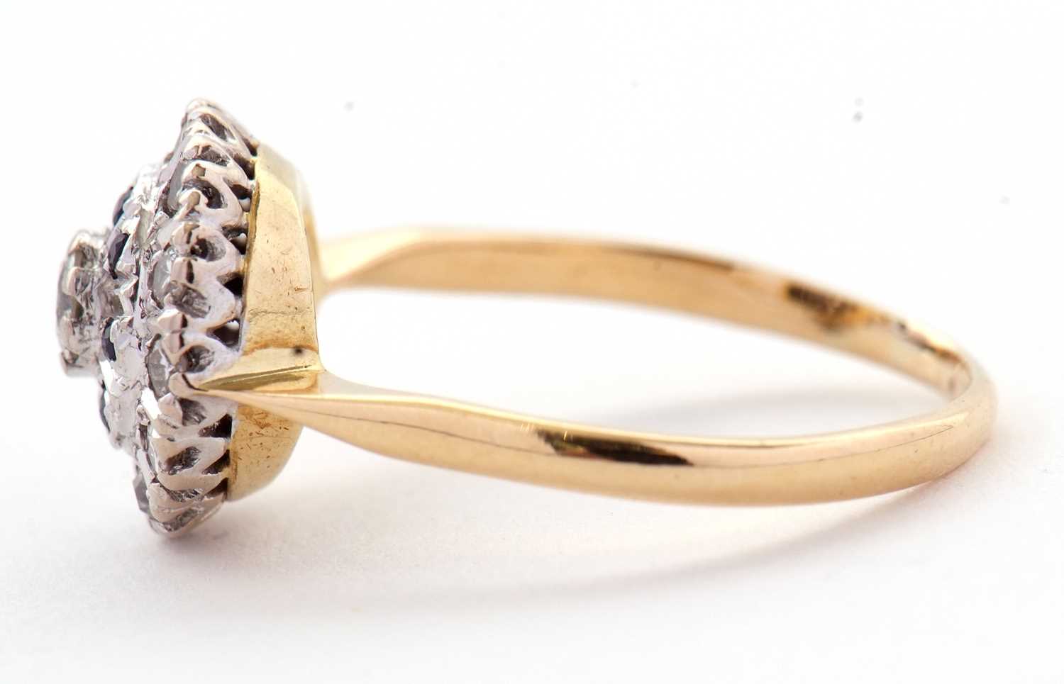 A sapphire and diamond cluster ring, the central round brilliant cut diamond surrounded by a ring of - Image 6 of 7