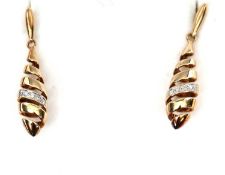 A pair of 9ct gold and diamond earrings, the gold spirals partially set with small round diamonds,