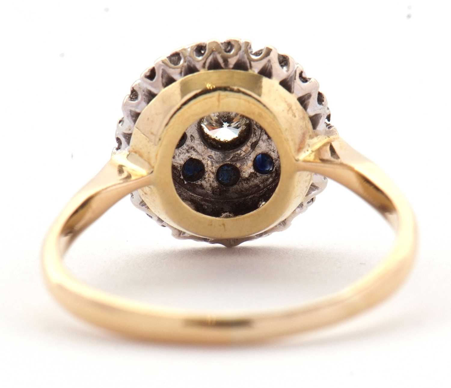 A sapphire and diamond cluster ring, the central round brilliant cut diamond surrounded by a ring of - Image 3 of 7