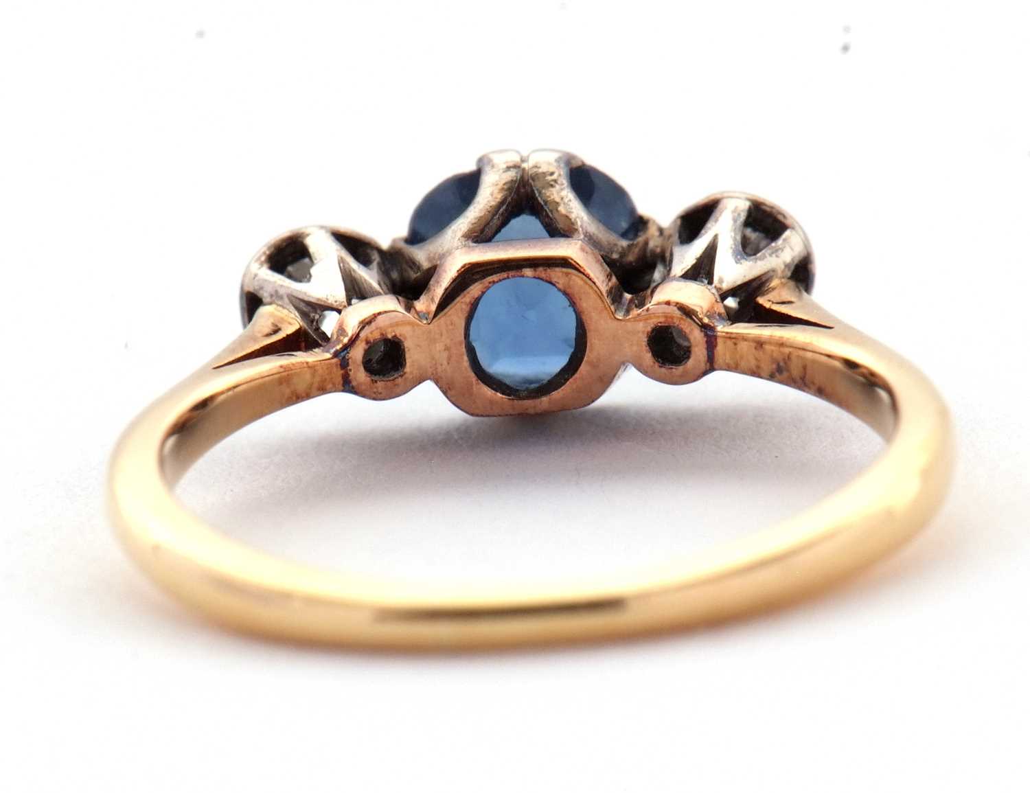 A sapphire and diamond ring, the central pale blue sapphire set to either side with an illusion - Image 6 of 6