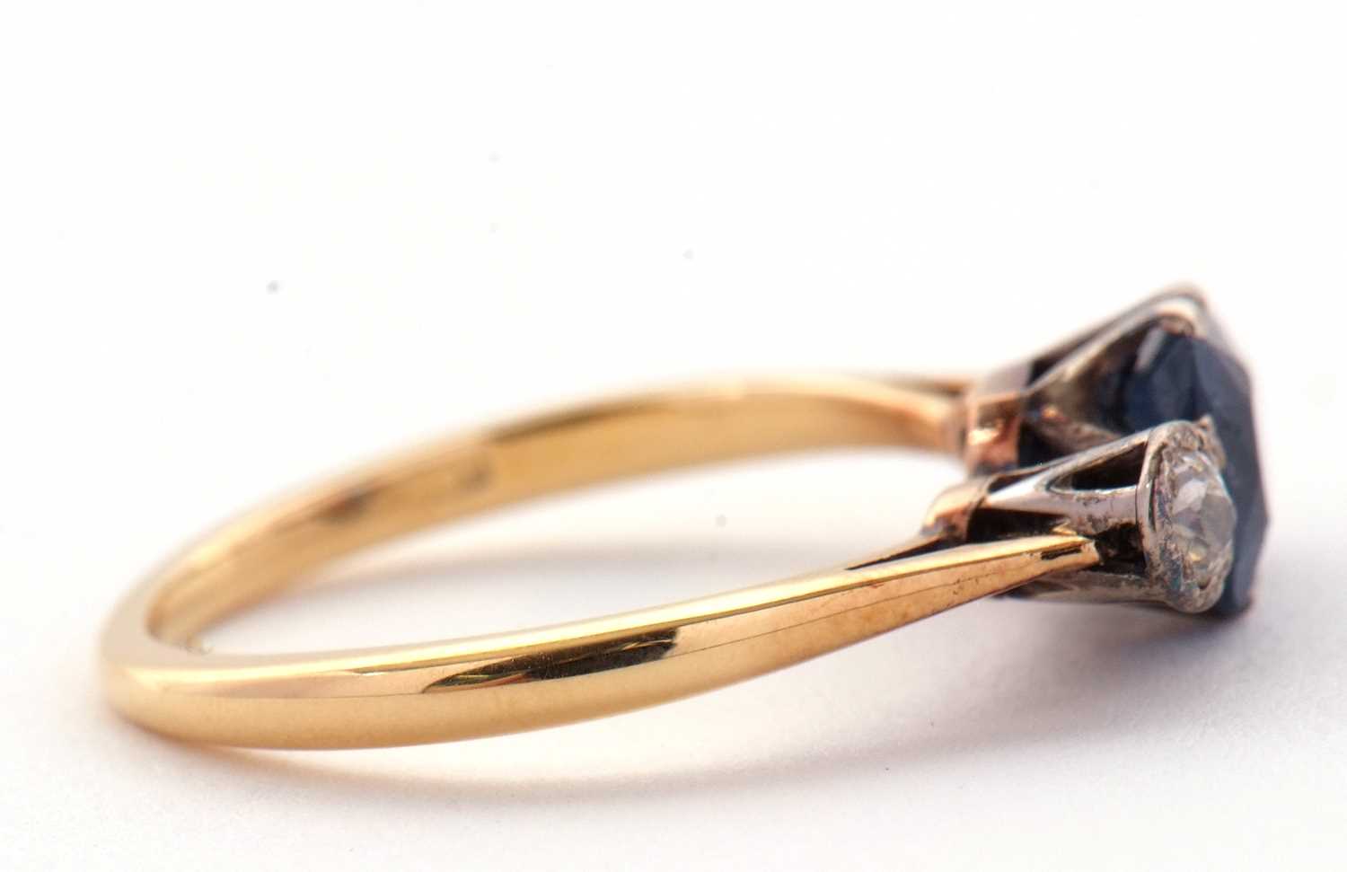 A sapphire and diamond ring, the central pale blue sapphire set to either side with an illusion - Image 3 of 6
