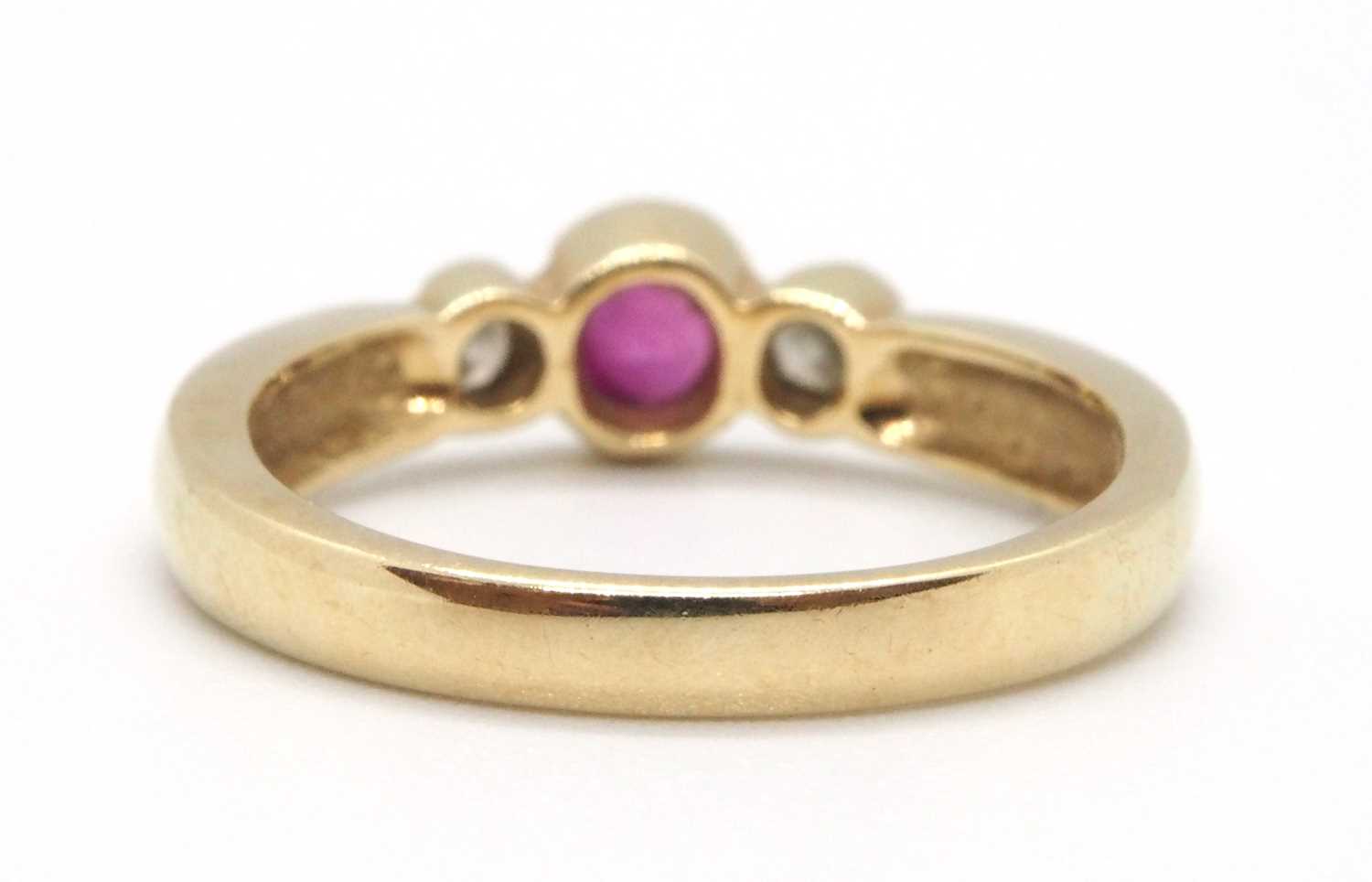 A 9ct ruby and diamond ring, the round collet mounted ruby with a round brilliant cut diamond to - Image 5 of 8