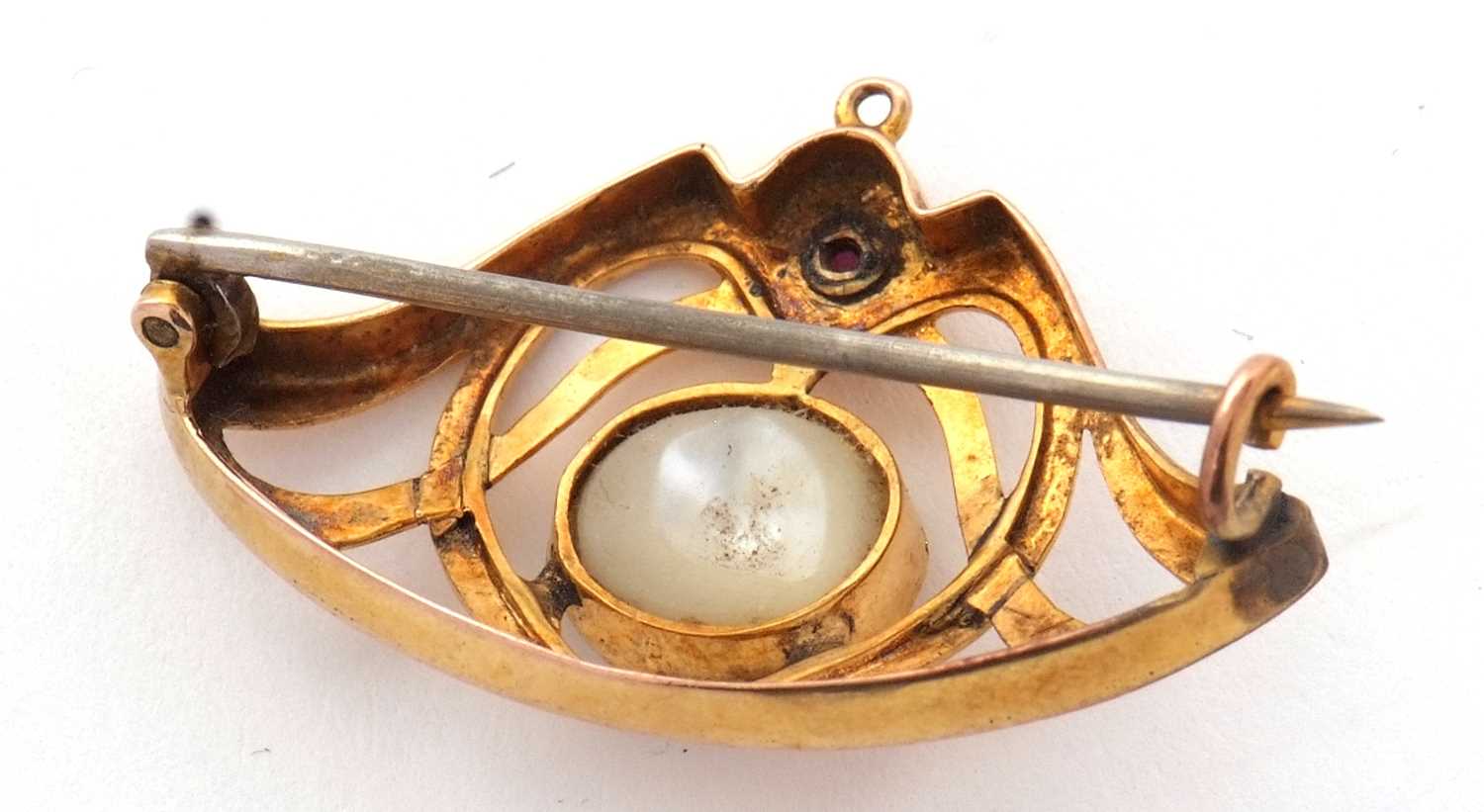An Art nouveau brooch, the central round blister pearl, collet mounted within a frame set with a - Image 2 of 4