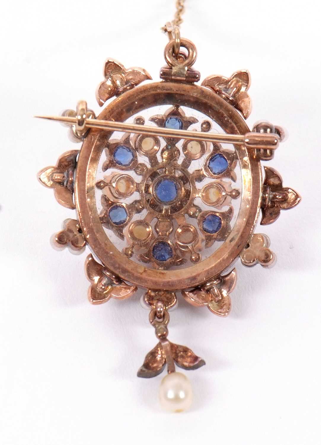 A late 19th century sapphire and pearl brooch, the ciruclar brooch set to centre with an oval - Image 2 of 3