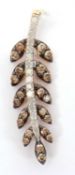 A 9ct brown and white diamond leaf pendant, the stem set with round white diamonds and the leaves