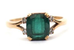 A 9ct green tourmaline ring, the mixed cut tourmaline with four diamond highlights, claw mounted