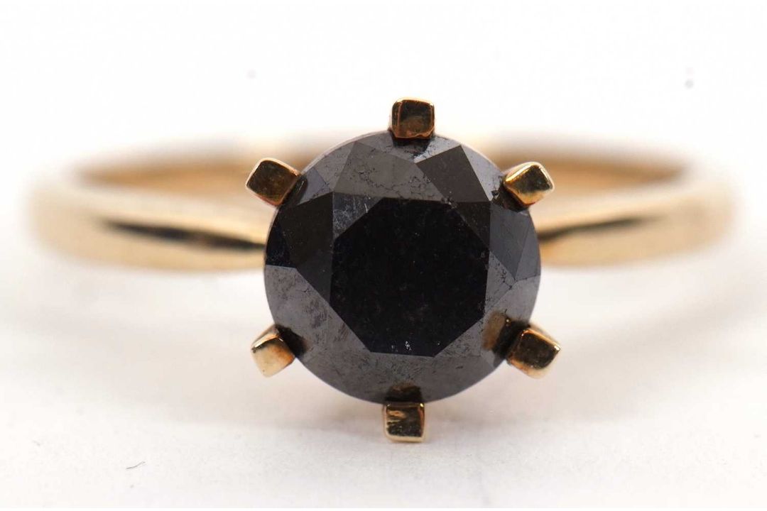 A 9ct black diamond ring, the round brilliant cut diamond, estimated approx. 2.0cts, in a six claw - Image 1 of 5